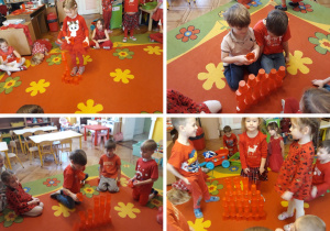 dzieci budują czerwone wieże z kubeczków