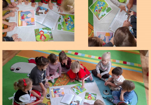 dzieci oglądają ilustracje do bajki Czerwony Kapturek